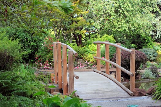Small crossing above a stream in a beautiful landscaped park.