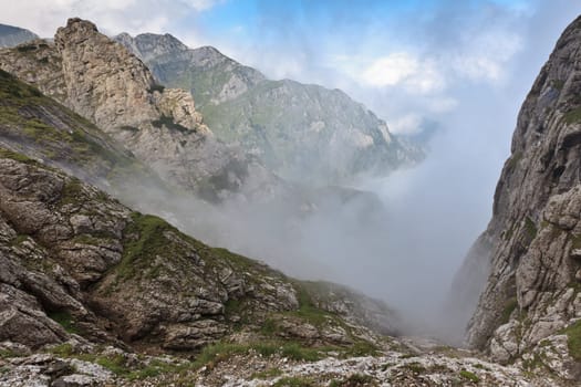 mountain valley in the mist, Bucegi mountains, Romania
