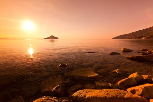 sunrise at sea on a rocky shore in Zakynthos, Greece