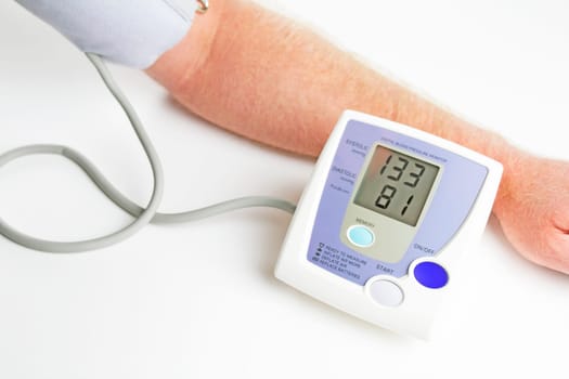 Man measuring his own blood pressure