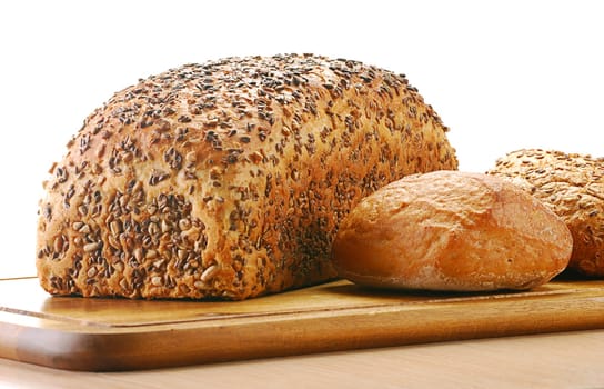 Composition with bread and rolls isolated on white