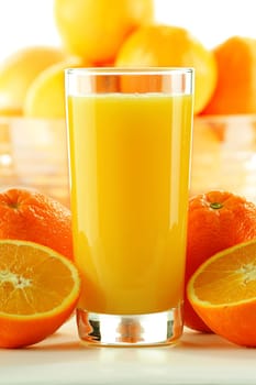 Composition with glass of orange juice and fruits
