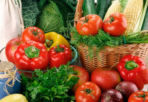 Composition with raw vegetables and wicker basket