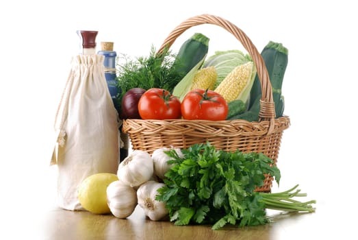 Composition with raw vegetables and wicker basket