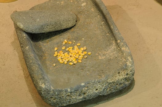 Ancient Hohokam Matate and Mono stone grain grinder with corn