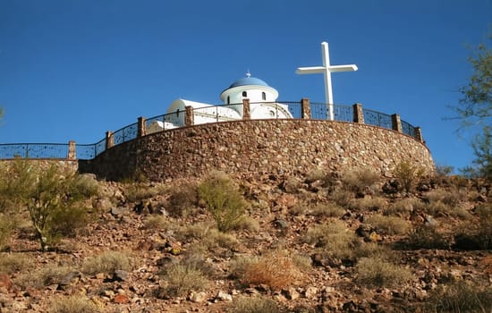 Greek orthodox chaple situated on top of a hill