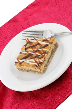 A rich and gooey sweet treat made from coconut, pecans, almonds.