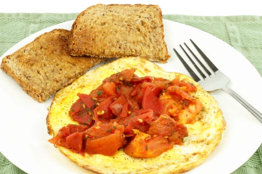 Healthy breakfast with buttered rye bread, protein and fruit with parsley.