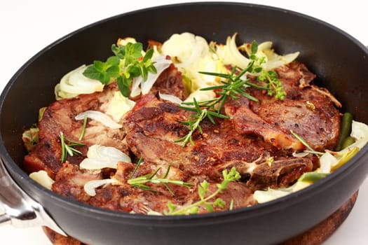Tasty roasted pork meat with cabbage and vegetable