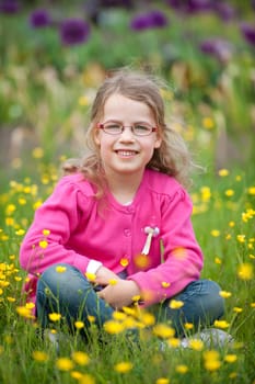 Young girl in a flower meadow