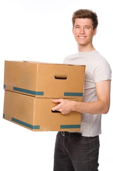 Studio shot of a young man with cardboard boxes
