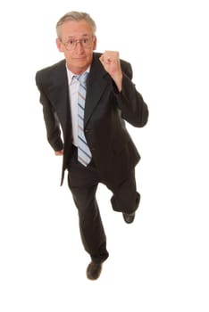 Senior businessman wearing suit running isolated over white