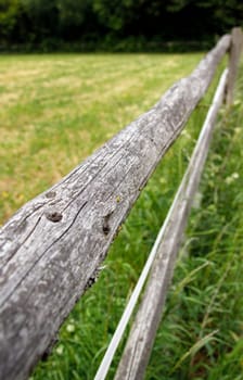Long wooden fence in the countryside