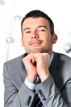 An attractive business man in a light business environment