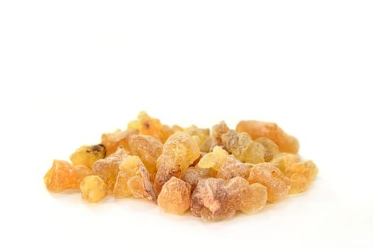 a handful of incense against a white background