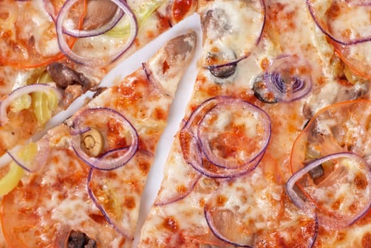 vegetable pizza closeup with tomato, Bulgarian pepper, onion, olive, champignons and mozzarella cheese