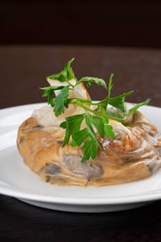 Tasty mushroom mix with cheese and cream wrapped at rice paper packet