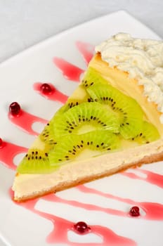tasty kiwi fresh cake closeup at plate