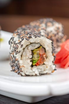 Closeup of Sushi rolls at plate with sesame