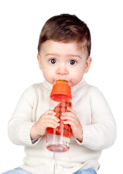 Beautiful baby with a bottle isolated on white background