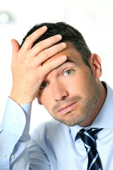 stressed overbooked and tired caucasian businessman