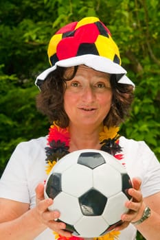 Female football fan with hat and Germany flag