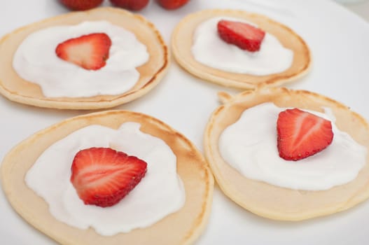 Homemade Flapjacks / Pancakes With Strawberries and Sweet Cream