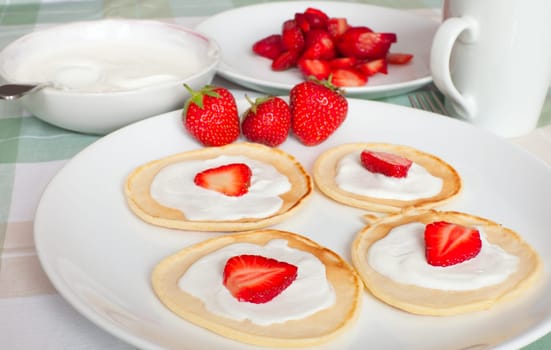 Homemade Flapjacks / Pancakes With Strawberries and Sweet Cream
