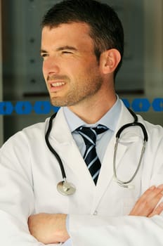 portrait of doctor in front an entrance of the hospital