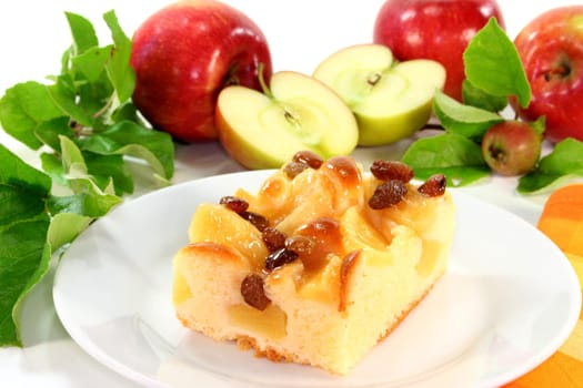 a piece of apple pie on a white plate