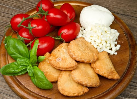 classic italian panzerotti with tomatoes and mozzarella