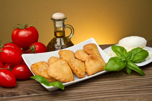 classic italian panzerotti with tomatoes and mozzarella