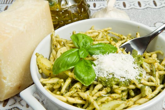 pasta with pesto on white plate