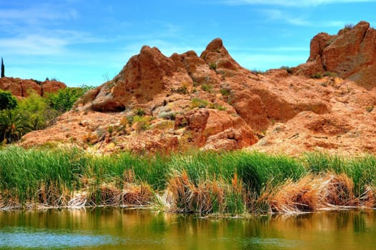 An Arizona desert pond rocks and mountains