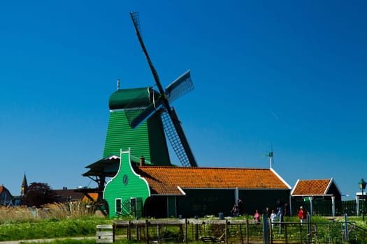Photo of windmill in Holland with blue sky