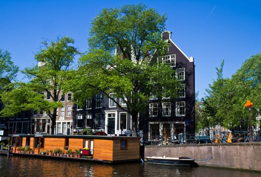 Beautiful houses on a canal in Amsterdam
