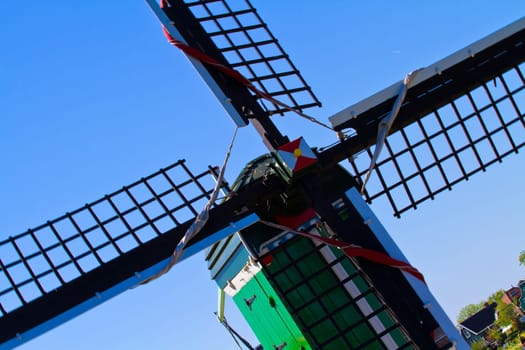 Photo of windmill in Holland with blue sky