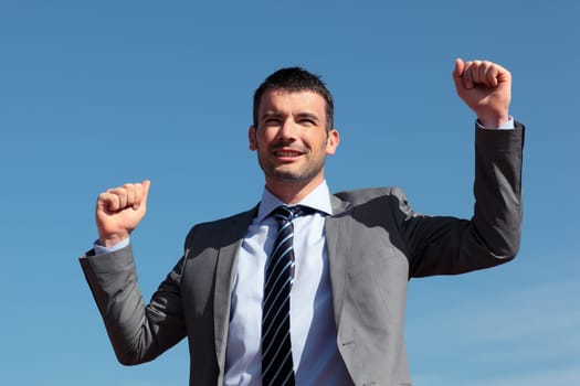 young businessman and blue sky in summer