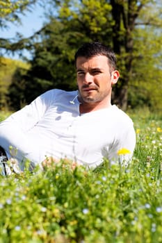 young man on the grass in a park