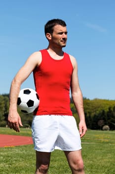 man with ball and blue sky in summer