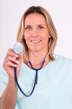 blond woman doctor with stethoscope in hospital