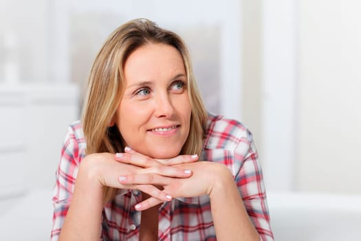 portrait of beautiful woman with head on the hands