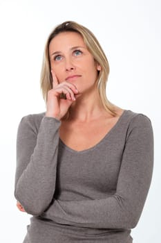 beautiful pensive woman in studio looking up