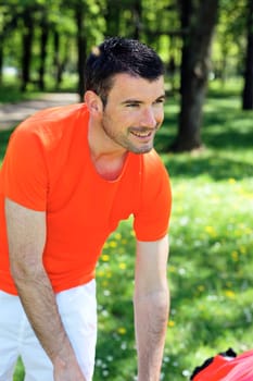 sportmans after run in a park in summer