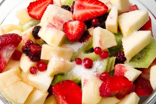 Fresh fruits salad on white background
