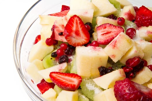 Fresh fruits salad on white background