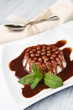 italian panna cotta dessert with chocolate topping