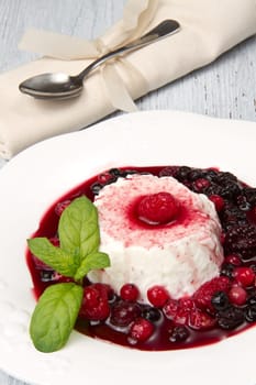 italian panna cotta dessert with fresh berries