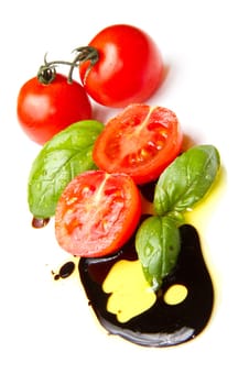 Fresh tomato and basil over olive oil and balsamic vinegar