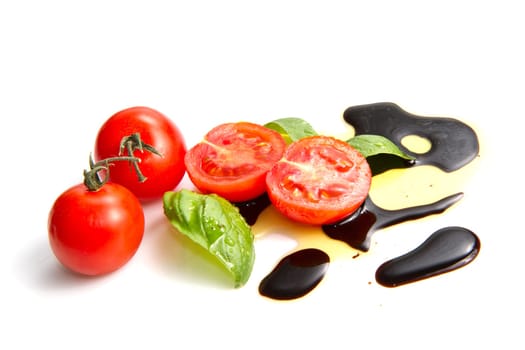Fresh tomato and basil over olive oil and balsamic vinegar
